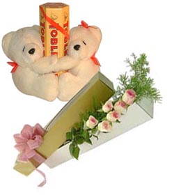 Two Teddies with six roses and tobler chocolates